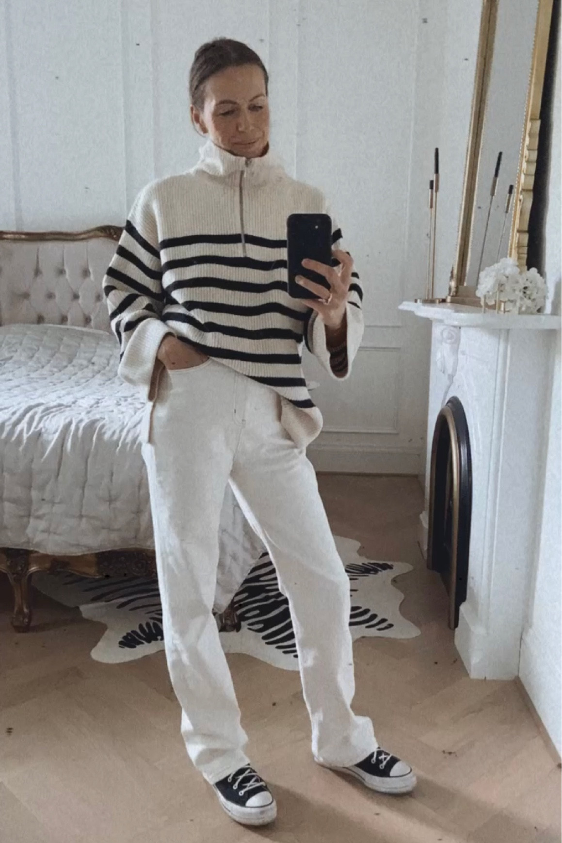 Neutral fall outfit with cream and black striped half-zip sweater, off white jeans, and converse sneakers

#LTKfindsunder100 #LTKstyletip #LTKSeasonal