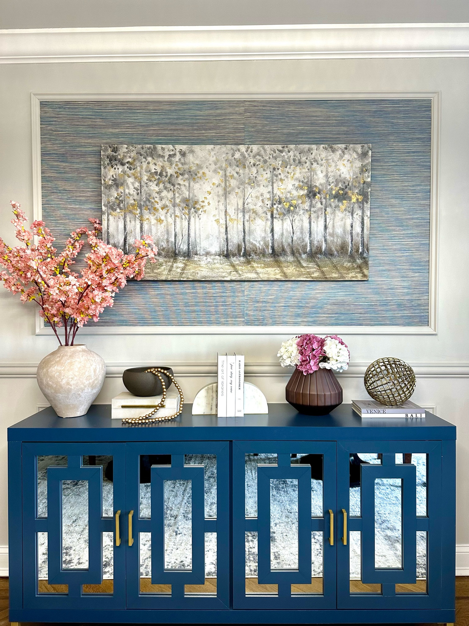 Sideboard styling. Dining room decor. Spring decor. Spring florals. Book ends. Pottery Barn Vase.

#LTKhome #LTKSeasonal #LTKstyletip