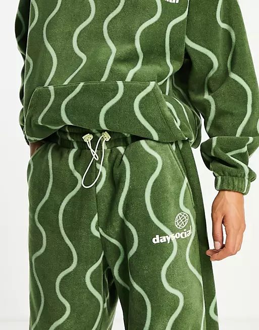 ASOS Daysocial relaxed sweatpants in polar fleece with all-over squiggle print in green | ASOS (Global)
