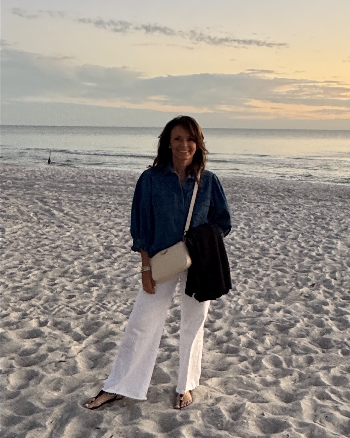 Vacation sunsets. 
Outfit of the night:
Denim puff sleeve button down top
White wide leg denim
Travel shawl

#LTKCyberWeek #LTKTravel #LTKSaleAlert