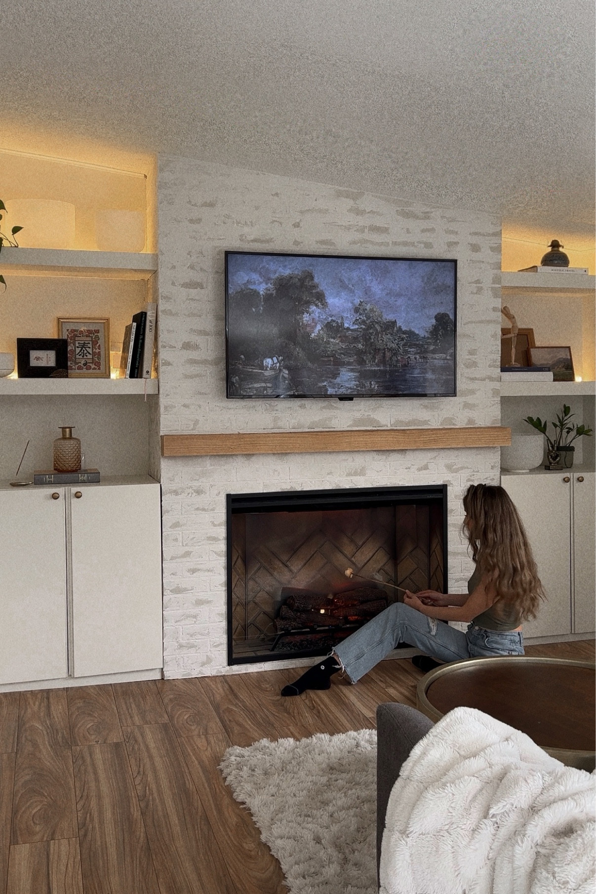 Fireplace. Cozy vibes. Incense. Apple TV. Frame tv. Nag champa. Sound bowls. Vibes. Fireplace renovation. Home project. Hygge. DIY. Shelf styling tips. Amazon find. Affordable artwork. 

#LTKunder50 

#LTKsalealert #LTKhome