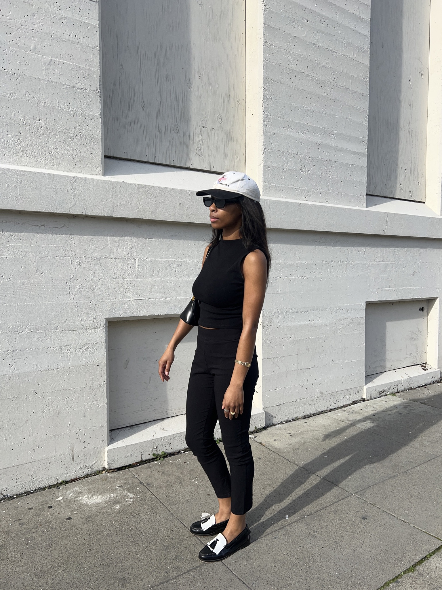 black top, black pants, black and white loafers, white dads hat, black purse and sunglasses. 

#LTKstyletip