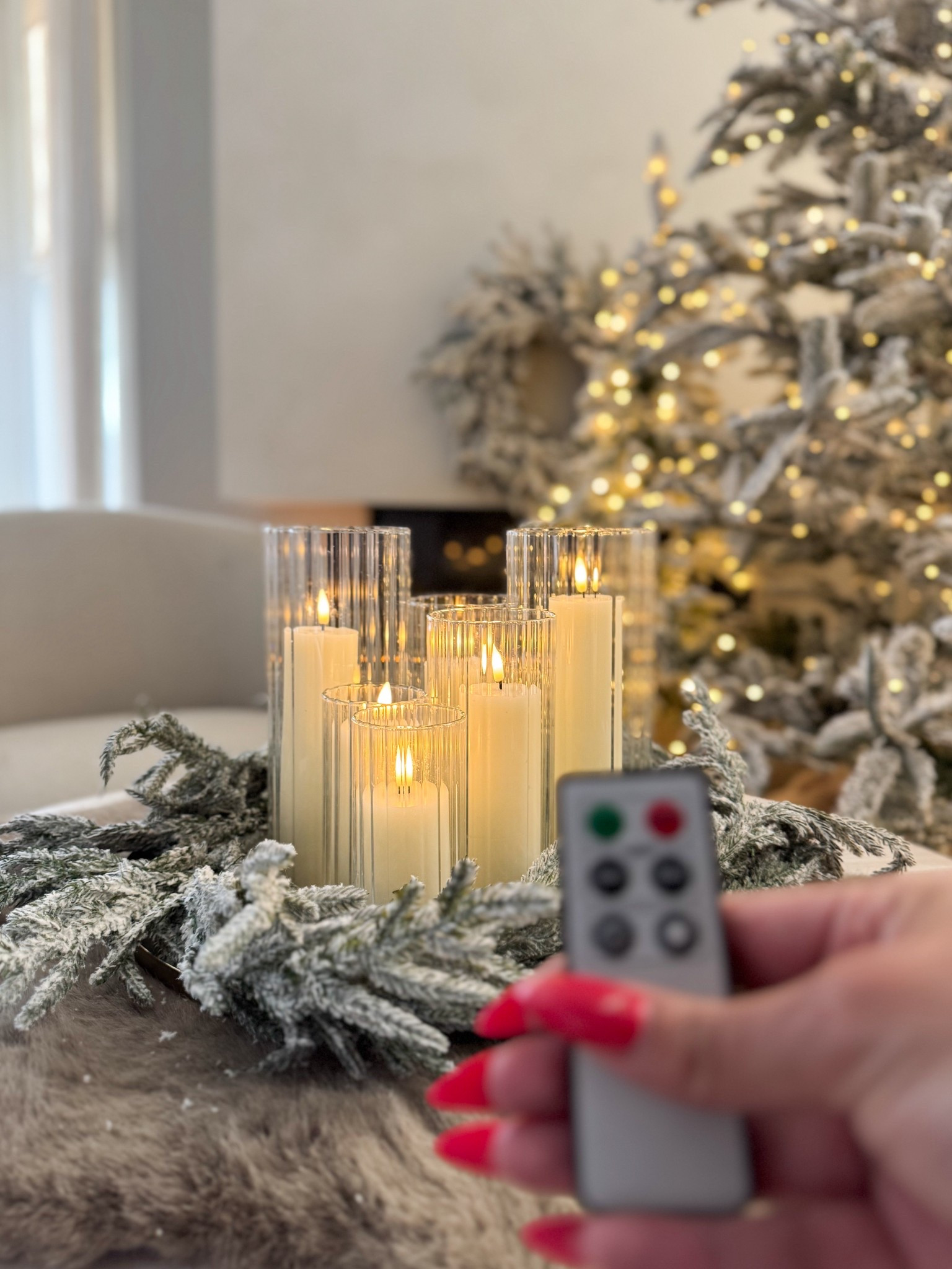 holiday coffee table styling

i love these modern ribbed hurricanes and these realistic battery operated candles

#LTKHoliday #LTKHome