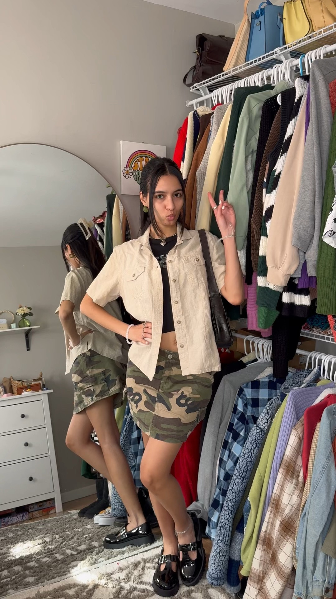 Khaki shirt, button up shirt, black crop top camo skirt, mini skirt, black shoes, claw  clip, Mary Jane shoes, shiny shoes, black bag, shoulder bag, silver jewelry, spring outfit, spring and spell casual spring outfit

#LTKshoecrush #LTKstyletip #LTKsalealert