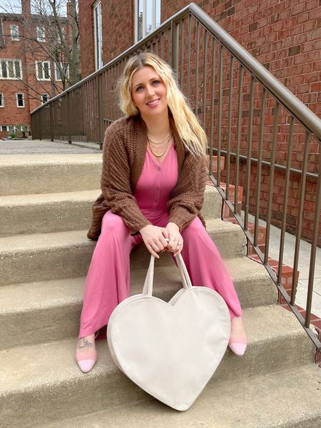 Neopolitan spring outfit. Pink wide leg jumpsuit with pockets. Knit oversized cardigan and oversized heart tote. 

#LTKstyletip #LTKitbag
