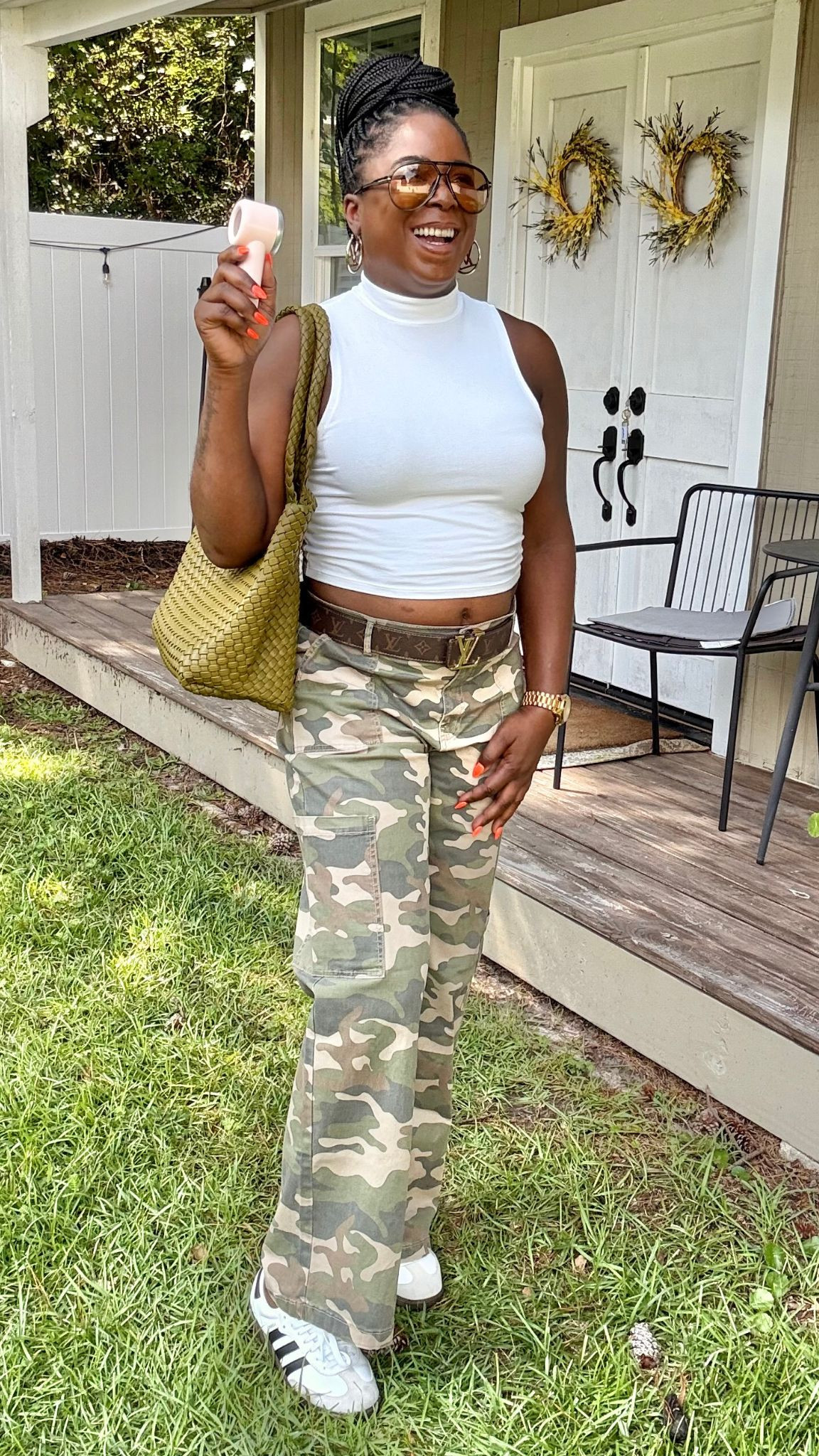 Here's another way to style camo cargo pants. I styled this casual outfit with a white crop top, Addidas Sumbra sneakers, a large bag & gold accessories. 

 #LTKOver40 #LTKSaleAlert #LTKFindsUnder100