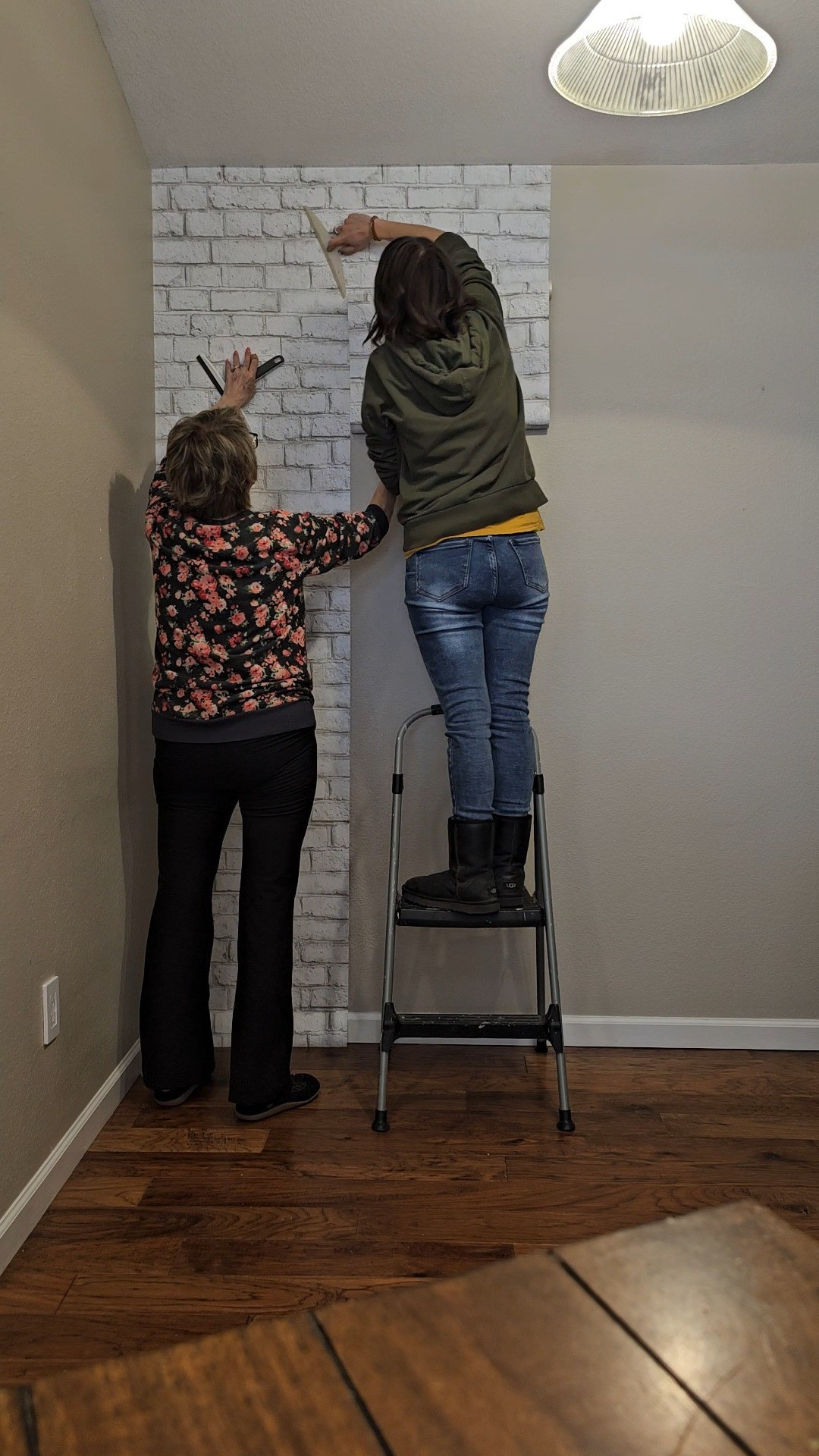This faux brick wallpaper is the perfect forgiving pattern for texture walls and beginners. We added this accent wall to my mom's kitchen and it made such a big difference in the space and was super easy to install! #wallpaper  

 #LTKHome