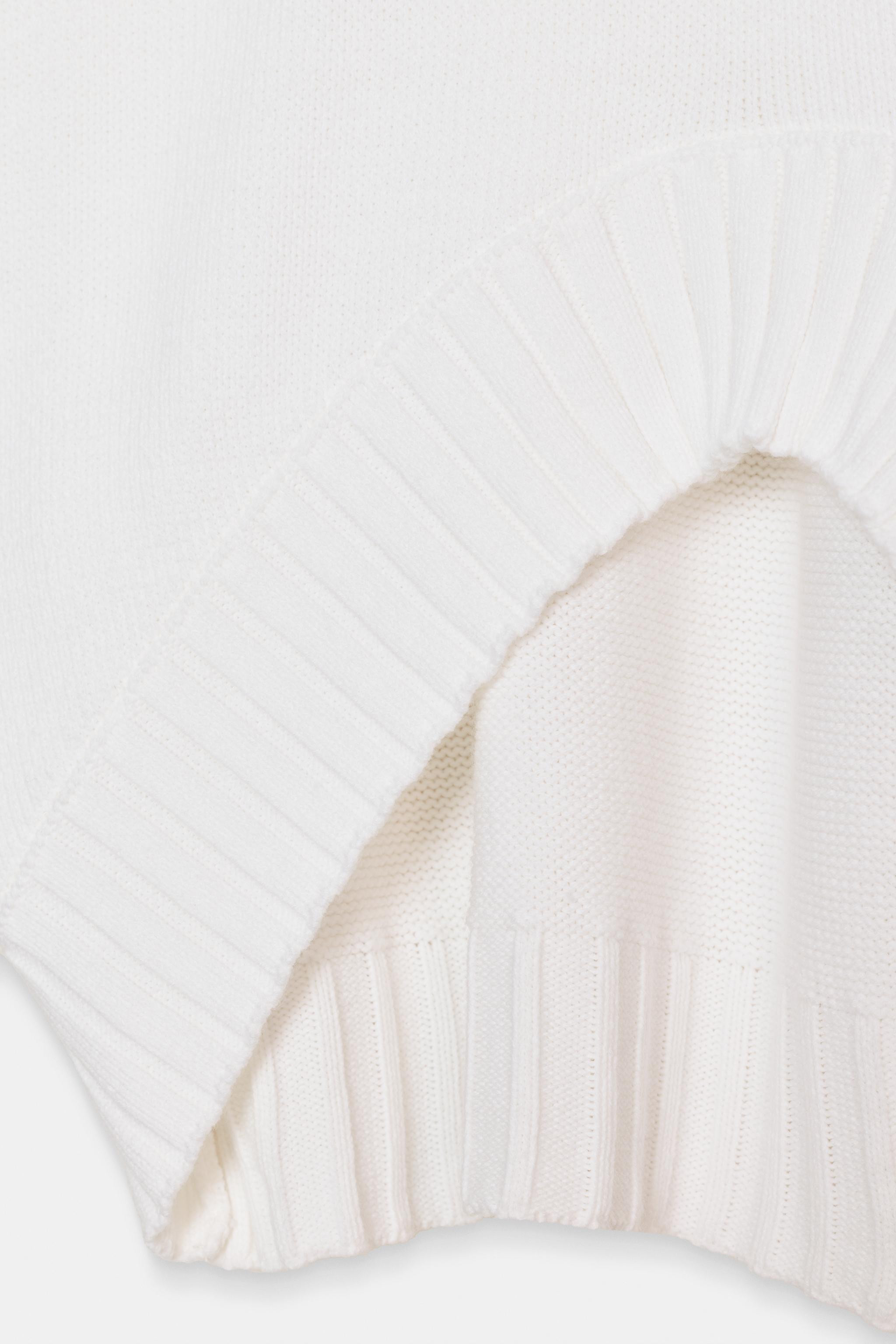 ASYMMETRIC HEM SHORT SLEEVE KNIT JUMPER | Zara US