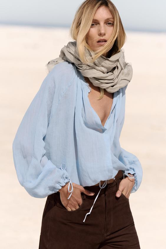 ZARA WOMAN COLLECTION Shirt made of lyocell yarn. Featuring a round neck, adjustable drawstring l... | Zara US