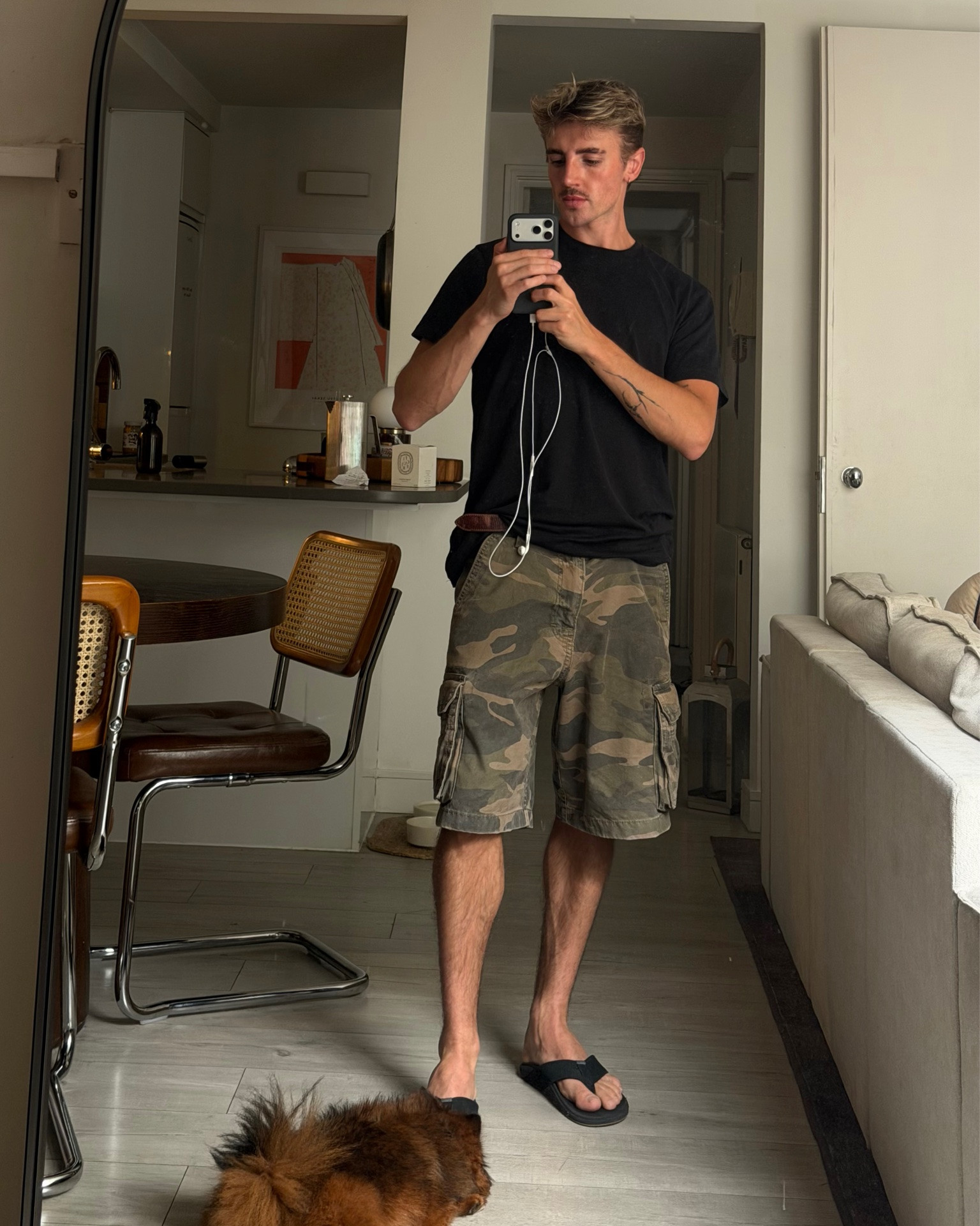 Euro summer outfit, black tee, camo cargo shorts and flip flops

#LTKMens #LTKootd #LTKTravel