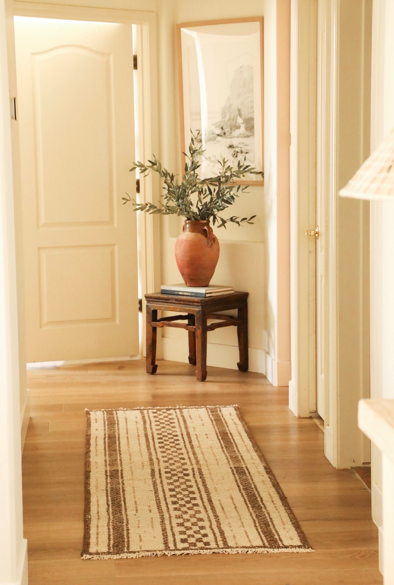 Rustic hallway styling #ltkhome #rusticdecor #earthyhome #homedecor #decor #rug #woolrug