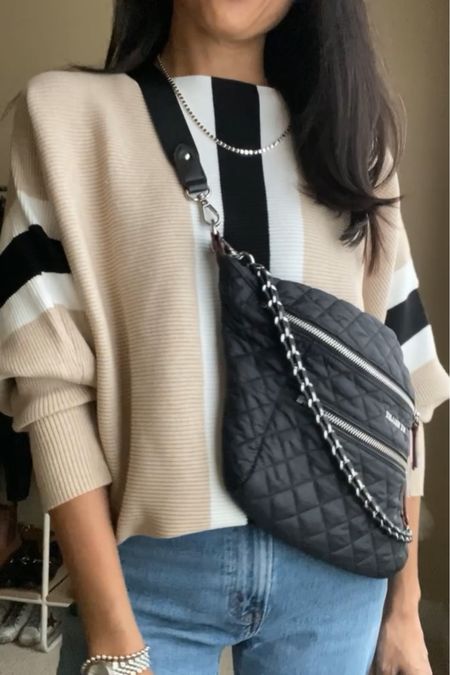 One of my favorite sweaters comes in this new pattern. Soft knit with dolman sleeves you can dress up or down. I have it in neutral solid colors from years’ past too. $33 Amazon find  
Sling bag is also a favorite for the last few years. 
Code HINTOFGLAM to save on jewelry. 
Jeans true to size. 

#LTKitbag #LTKfindsunder50 #LTKover40