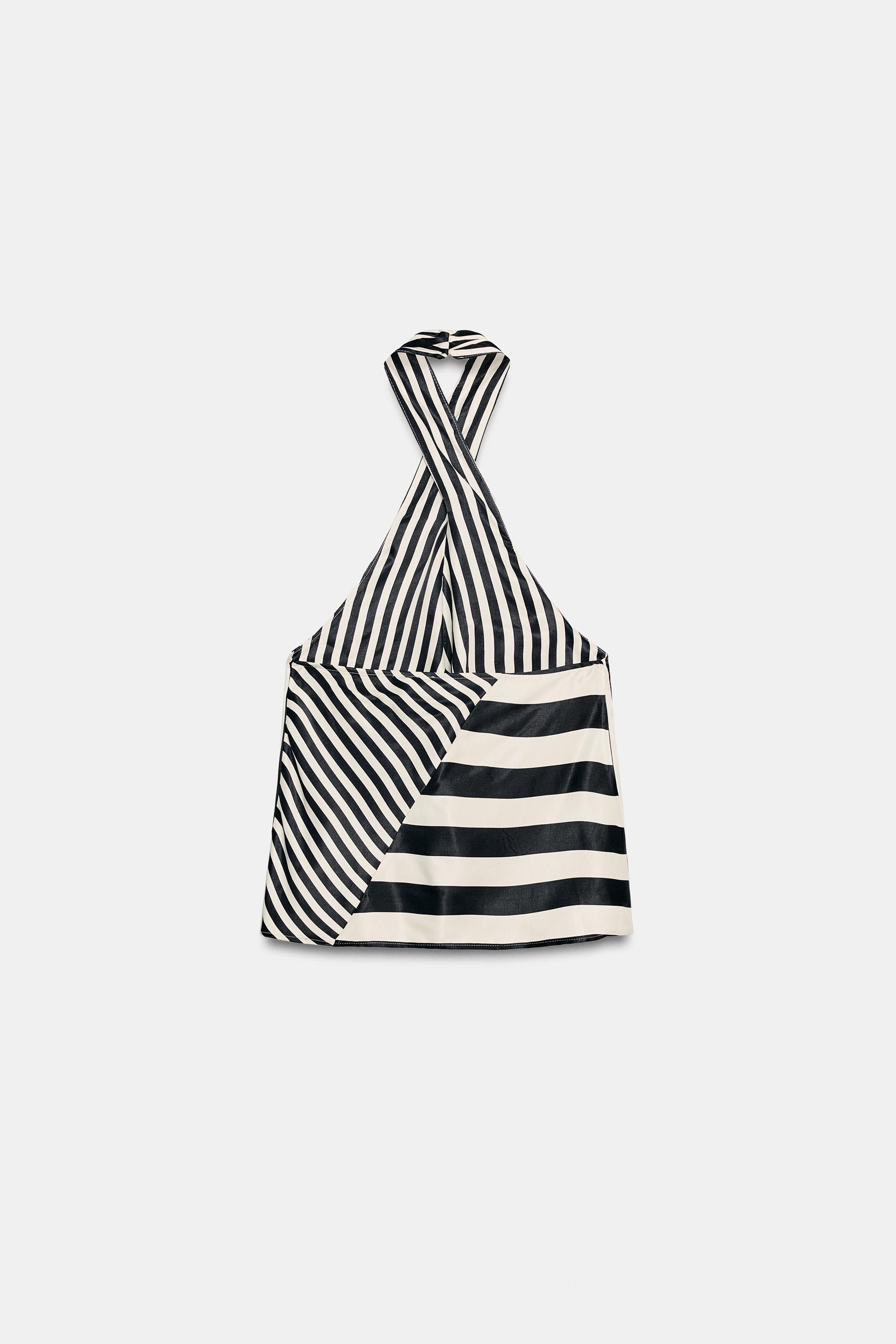 Crossed halter neck top with an open back. Back closure with hidden buttons. | Zara US