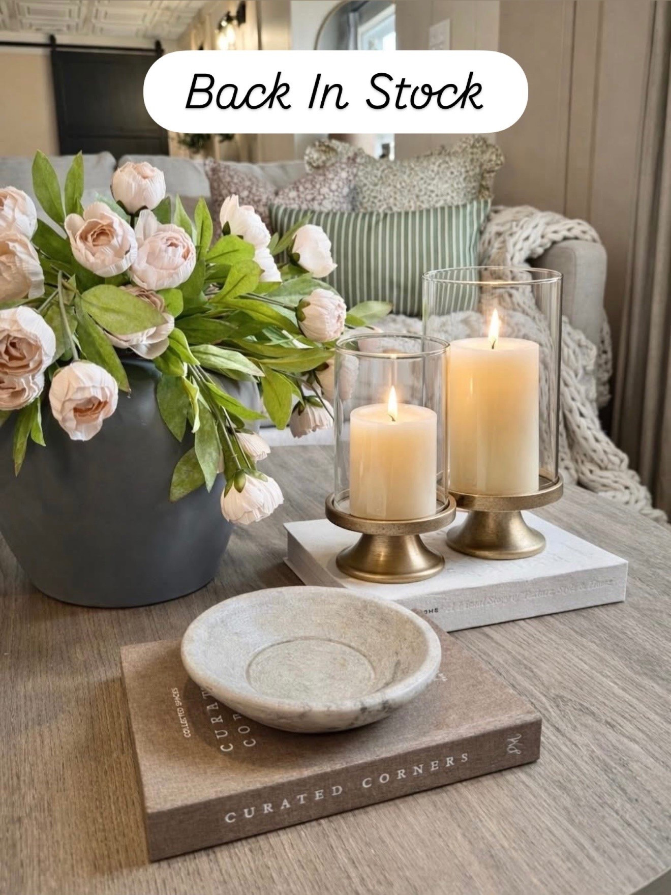 Back In Stock 
Follow @farmtotablecreations on Instagram for more cozy, designer-inspired finds 🤍

This hurricane candle holder set from Amazon is one of those quiet luxury pieces that instantly elevates your space. The brass pedestal base paired with the glass cylinders gives that high-end, designer look you see styled in magazines—without the designer price tag.

I love how they add height and warmth to a coffee table, especially layered with books, a marble bowl, and soft florals like this. The glow is SO cozy at night and makes your whole space feel intentional and pulled together.

If you’ve been wanting that “styled but effortless” look… this is it. Grab them now while they are still in stock.

#candleholders #coffeetabledecor #livingroomdecor #homedecor #decorfinds

coffee table decor | hurricane candle holders | brass decor | glass candle holders | neutral home decor | living room styling | cozy home | designer look for less | amazon home finds | home styling ideas | neutral aesthetic | coffee table styling | decorative accents | home decor ideas | modern classic decor | warm neutral decor | living room inspo | interior styling | affordable decor | candle decor | brass accents | layered decor | home details | neutral living room | decor inspiration

#LTKHome #LTKSaleAlert