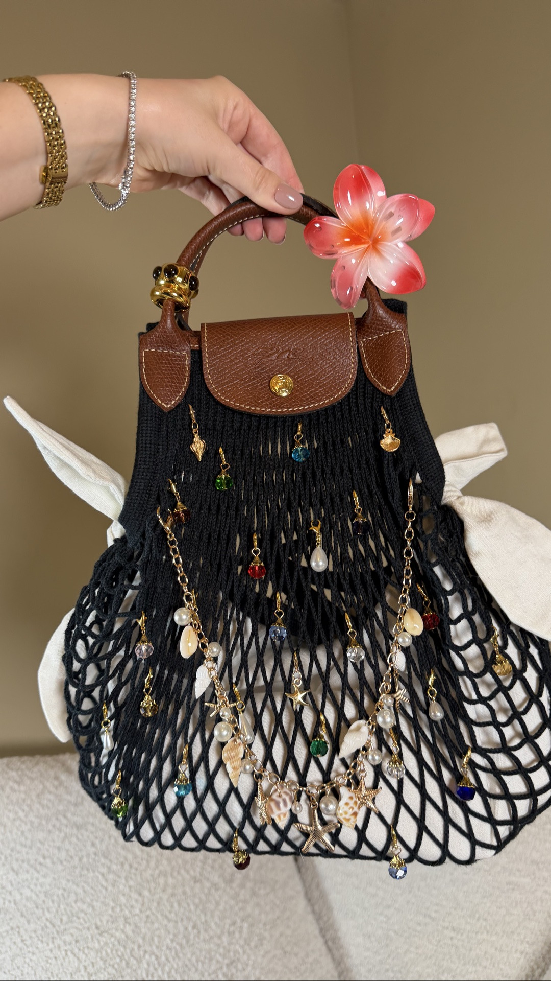 Adding all the thingamabobs and shells to this dreamy bag 🐚🪎
The Longchamp Le filet is the ultimate summer bag 🧜🏻‍♀️

I tried to stick with the mermaid vibes packing with the sparkly glossier birthday cake lip balm,  tropical flower hair clips, Guerlain gold custom lipstick case, cavallinia crystal notebook, elf who glow glowing sunscreen, quirky Mackenzie child’s hair brush, and of course and the gems, shells and pearls hanging on the bag! Most are from Amazon. The clip on beads for the handle are from Madewell ♥️
 Longchamp Le Pliage Le filet net bag, summer bag, summer fashion

#LTKootd #LTKdayinmylife #LTKxMadewell