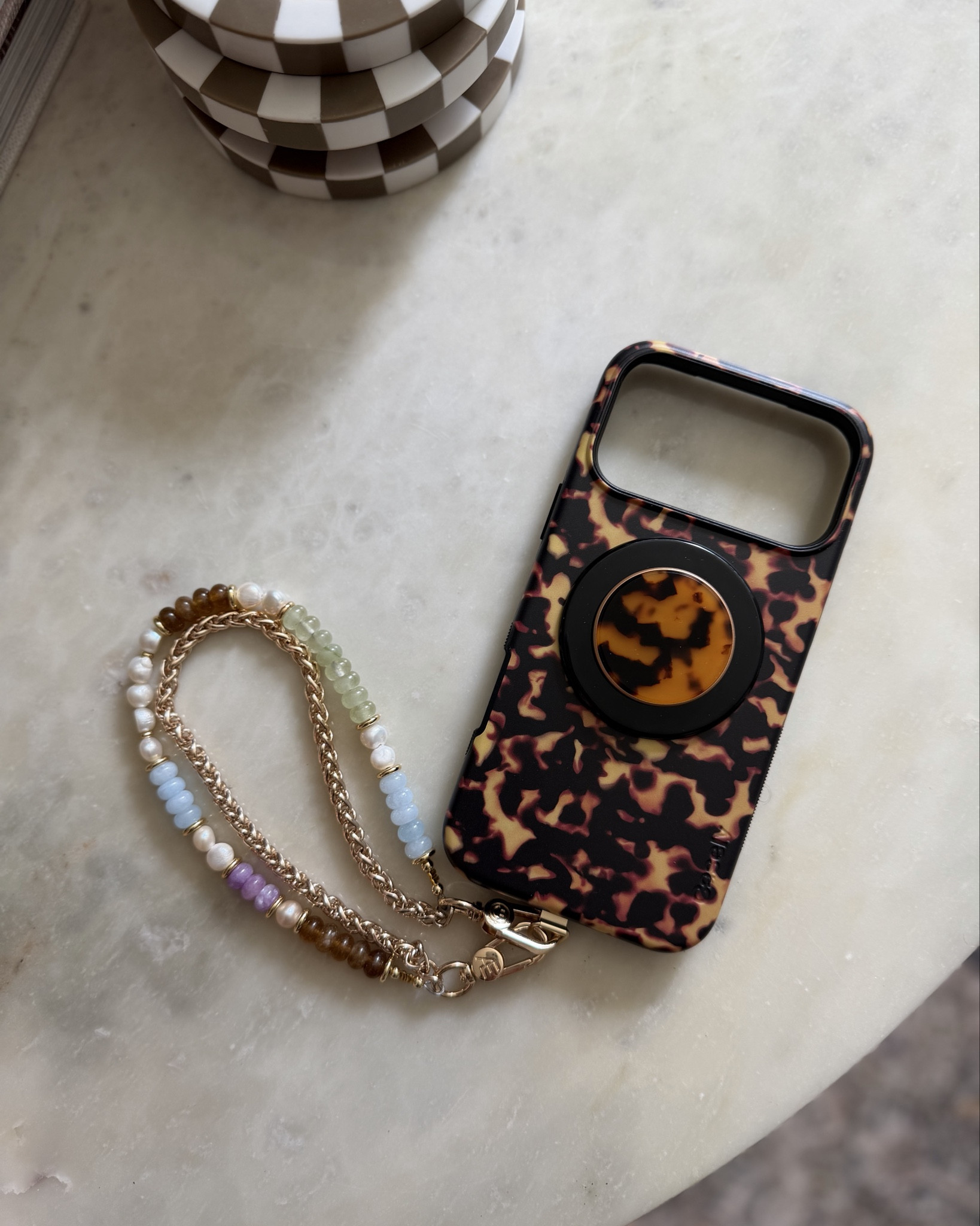 New Casely case for my iPhone 17 pro max! Also grabbed a matching tortoise magnetic pop socket. Linking to the metal tab I use to connect my chain, too! I always get asked about that 🤎

Fall phone cases, iPhone 17 pro max, casely phone case, fall colors, tortoise shell 

#LTKSeasonal #LTKFindsUnder100