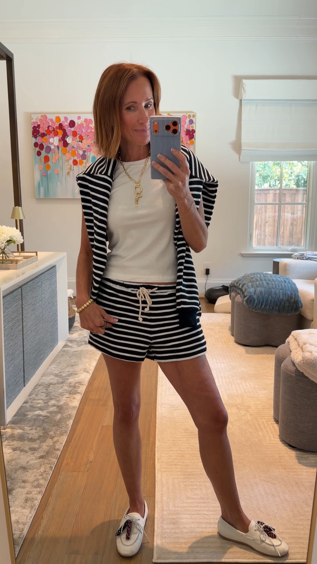 Matching sets are my summer weakness and this American Eagle navy and white striped shorts and sweatshirt set just made it to the top of the list — the shorts are 40% off and the sweatshirt is 30% off right now, which makes it such a good time to grab both. The relaxed fit and nautical stripe print make it one of those easy summer casual outfits that works for everything from a morning coffee run to a beach day. I finished it off with my Sperry x Aritzia sneakers and a Tori Bradbury gold layered necklace to keep it feeling put together without trying too hard.

#LTKootd #LTKmomlife #LTKSaleAlert
