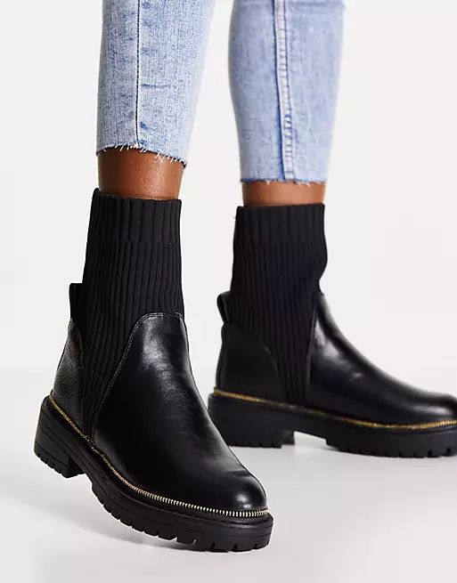 River Island chunky cleated sole heeled sock boot in black | ASOS (Global)