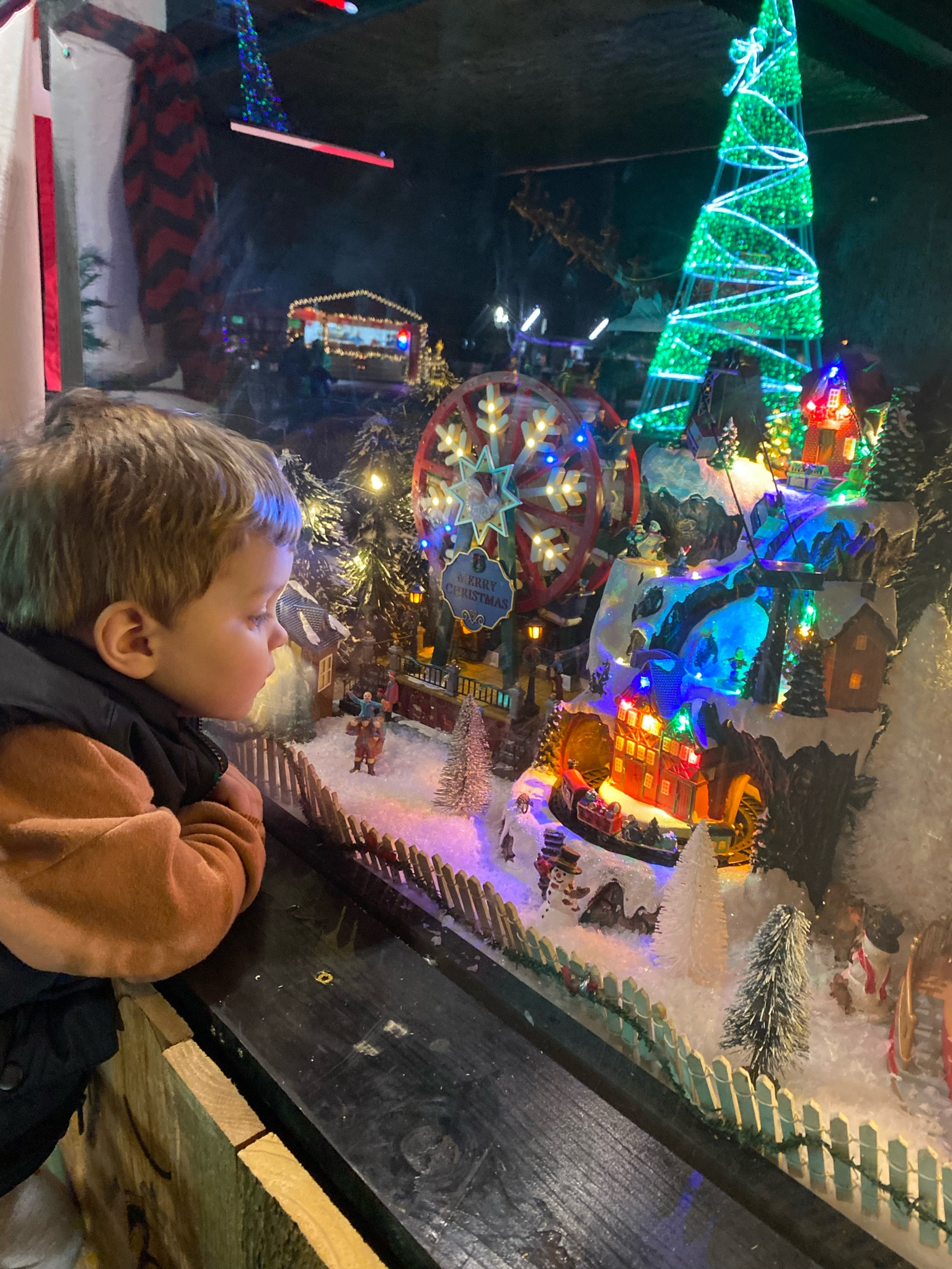 Christmas village at the speedway! Love seeing Christmas through his eyes 🥹

#LTKSeasonal #LTKKids #LTKFamily