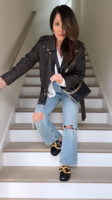 Running errands kind of day!
Outfit of the day 
Love this leather jacket, it’s retro inspired and very cool💕
My top is very flowy but I’ve done a front tuck.
My jeans aren’t available anymore but I’ve linked similar below ⬇️ 
Love my jw mules and get compliments all the time on them! Limited sizes left - runs true to size. 
I’m wearing size 38 in the leather jacket for reference. 


#LTKshoecrush #LTKfindsunder100 #LTKMostLoved