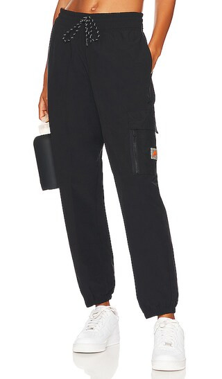 NSW Cargo Sweatpant in Black & Safety Orange | Revolve Clothing (Global)