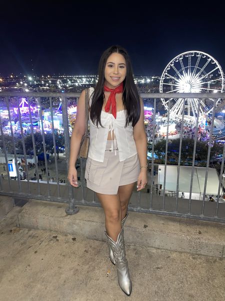 Western outfit idea 
Bad bunny concert outfit idea 
Red bandana 
White bustier top: small
Utility skort: small 
Silver cowboy boots: 6.5 women 
Gucci Dionysus bag 

#LTKstyletip #LTKSeasonal #LTKfindsunder100