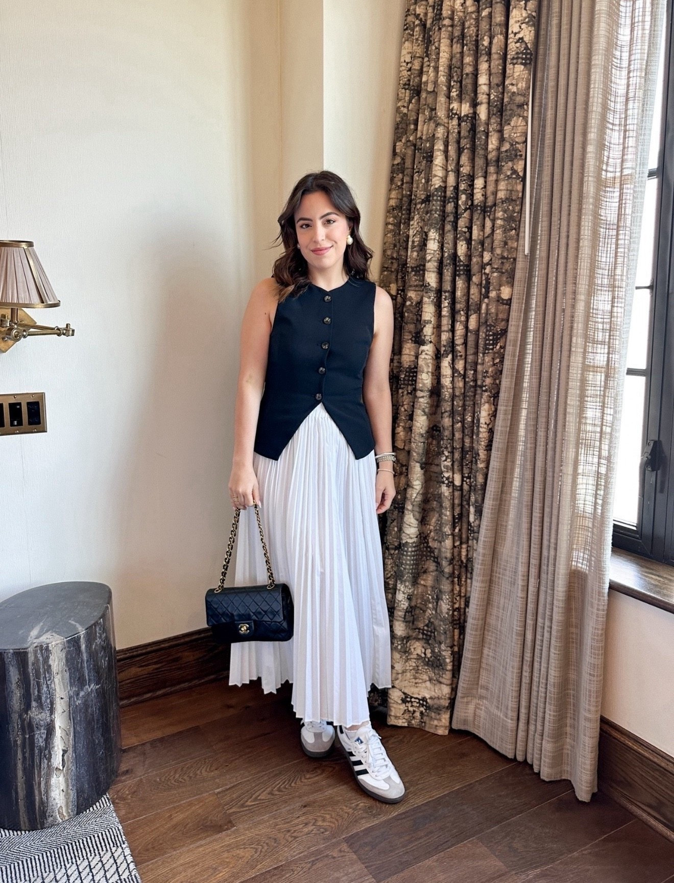 My go-to Summer uniform! Styled a structured black vest and soften it up with a white pleated midi skirt. Finished the look with some Adidas Sambas for an outfit that feels polished but totally wearable all day.

minimalist outfit, vacation dress, casual chic, preppy look, timeless fashion, petite style, pinterest inspo, old money aesthetic

#LTKU #LTKSeasonal #LTKootd