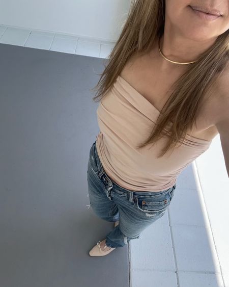 Nude ruched tube top with a thin gold choker necklace, nude ballet flats and distressed boyfriend jeans.

#LTKStyleTip #LTKSaleAlert #LTKShoeCrush
