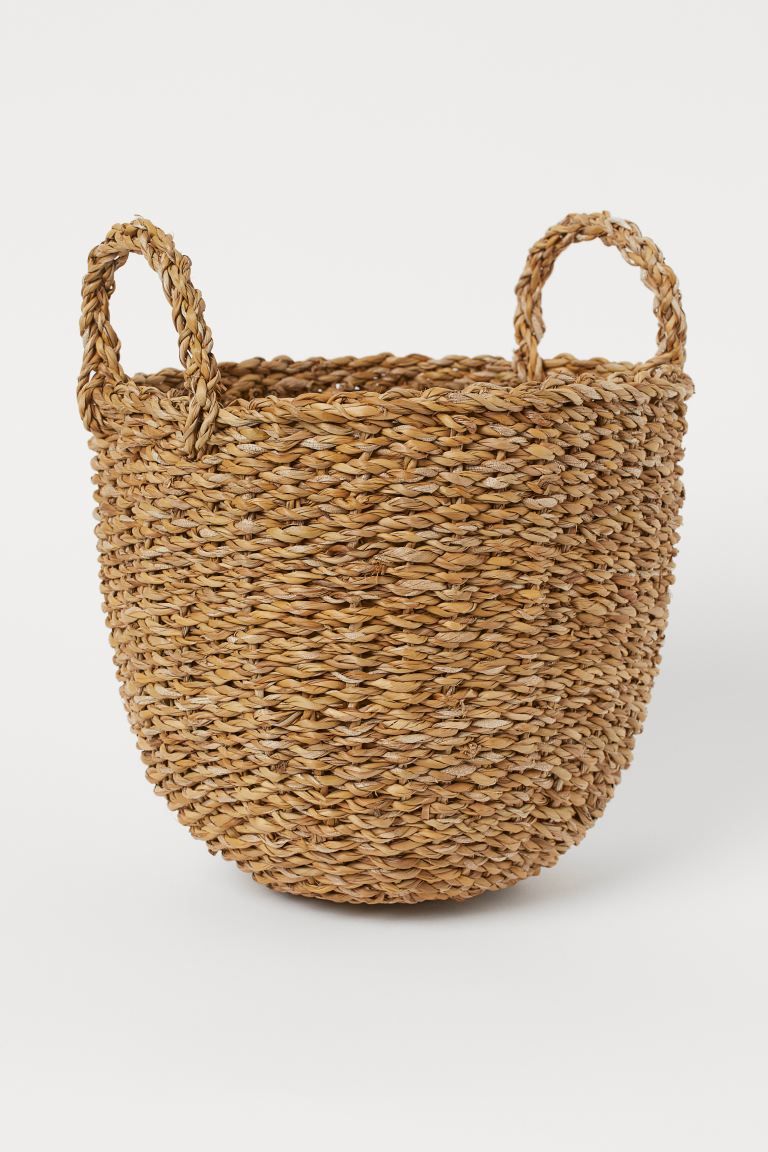 Small storage basket in hand-braided seagrass with two handles at top. Height 9 1/2 in. Diameter ... | H&M (US + CA)