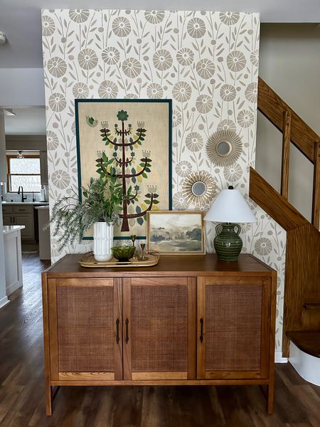 Large scale floral stencil wall looks like wallpaper! This MCM foyer with a budget-friendly console table is welcoming and chic, while also being playful. 

stencil | floral | wallpaper | accent wall | foyer | entryway | console | credenza | buffet | mcm | mid-century | boho | vintage | retro | neutral | green

#LTKhome #LTKfindsunder50