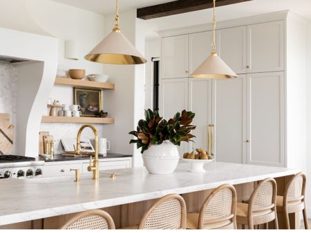 Get the look for less!! White and brass cone pendants.
📷: Studio McGee 