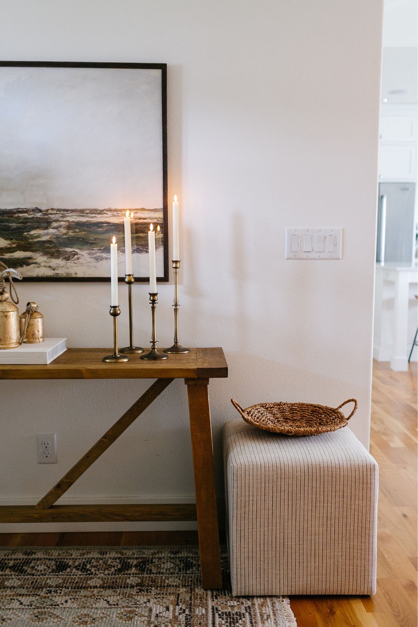 Christmas decor, holiday decor, entryway decor, farmhouse table, living room decor, wall art, artwork, brass candle holders, LED candles, brass bells, faux trees, Amazon Home, Target Studio McGee, area rug, upholstered ottoman 

#LTKSeasonal #LTKhome #LTKHoliday