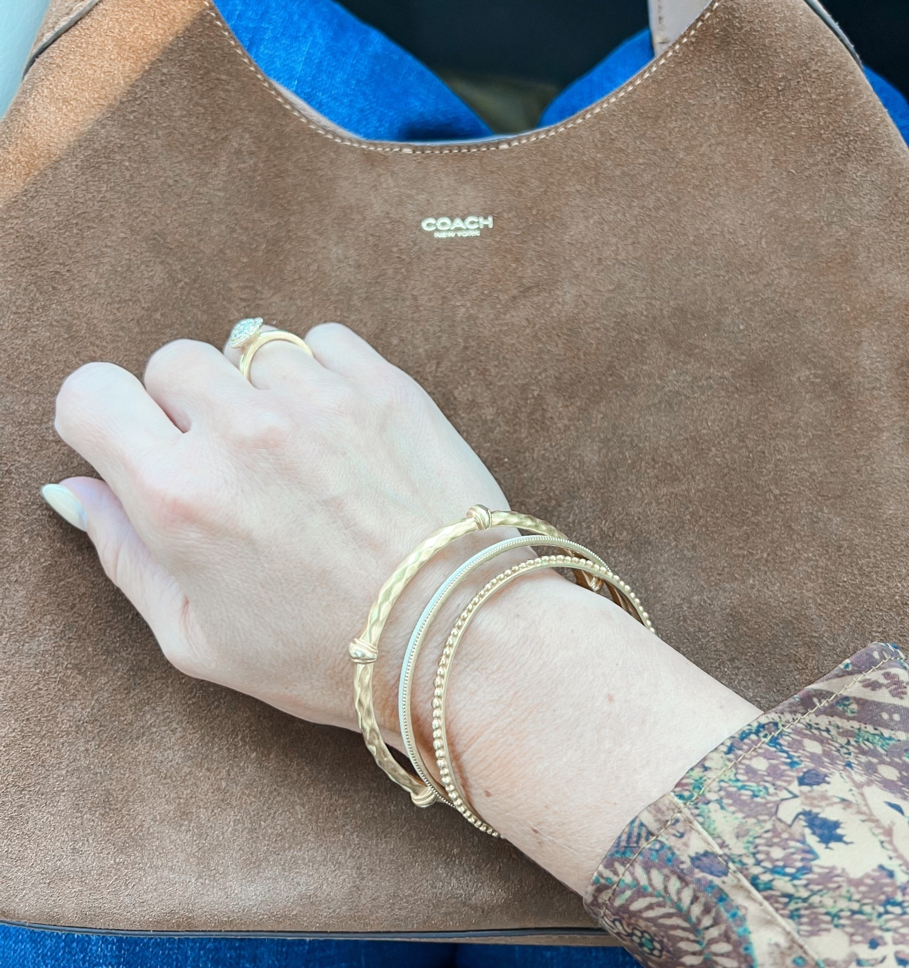 Gold bangles accessories suede purse suede handbag 

#LTKootd #LTKGiftGuide #LTKSaleAlert