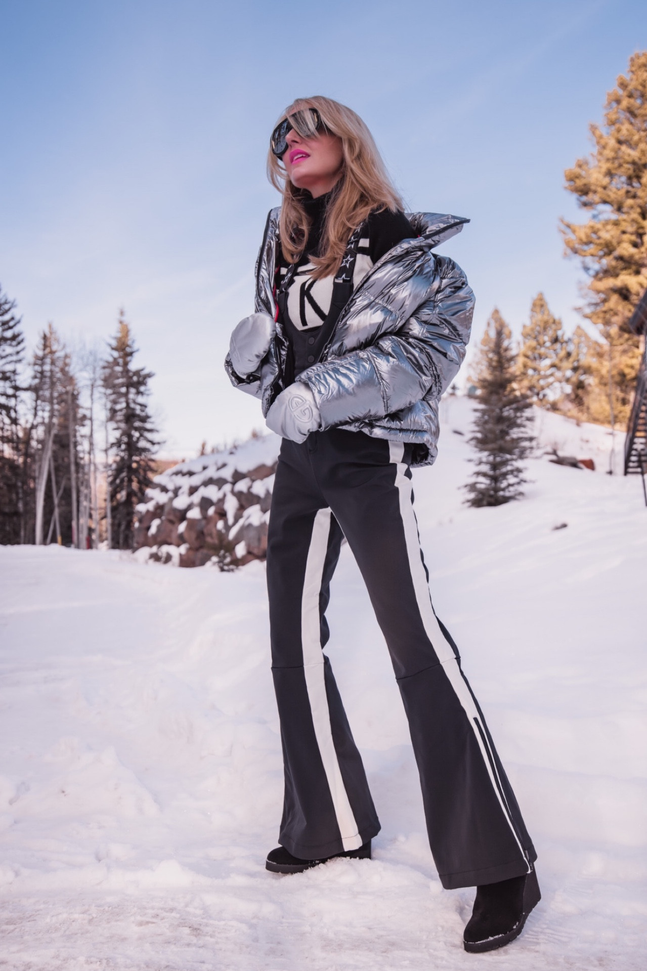 When it comes to skiing, there’s a few different options for what to wear. I prefer a ski suit or overalls. For my ski outfit today, I paired a really chic metallic puffer by Perfect Moment with silver Goldbergh mittens, which are both very on trend, with some chic black Perfect Moment ski overalls. I finished the look with some ultra cool Loewe aviator sunglasses that I LOVE! 

Fits are true to size.

~Erin xo 

#LTKTravel #LTKFitness #LTKSeasonal