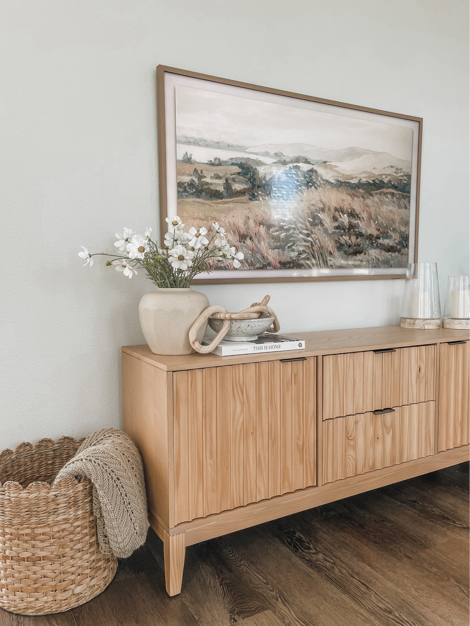 Spring media console decor, Samsung frame TV, TV stand, spring florals, hurricane candle holders. 

#LTKSeasonal #LTKhome