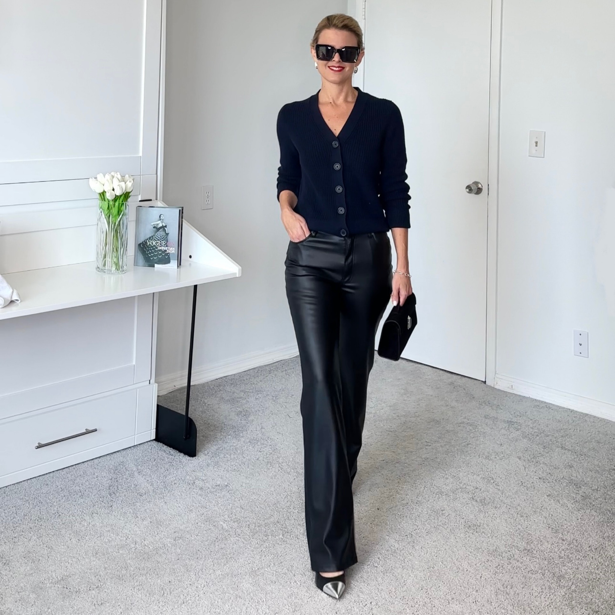 Navy and black can be worn together.    The trick to making it look intentional is to use different fabrics and textures.    The navy sweater, with the black leather pants and the suede bag gave this look depth.  

#LTKSeasonal #LTKstyletip #LTKfindsunder50