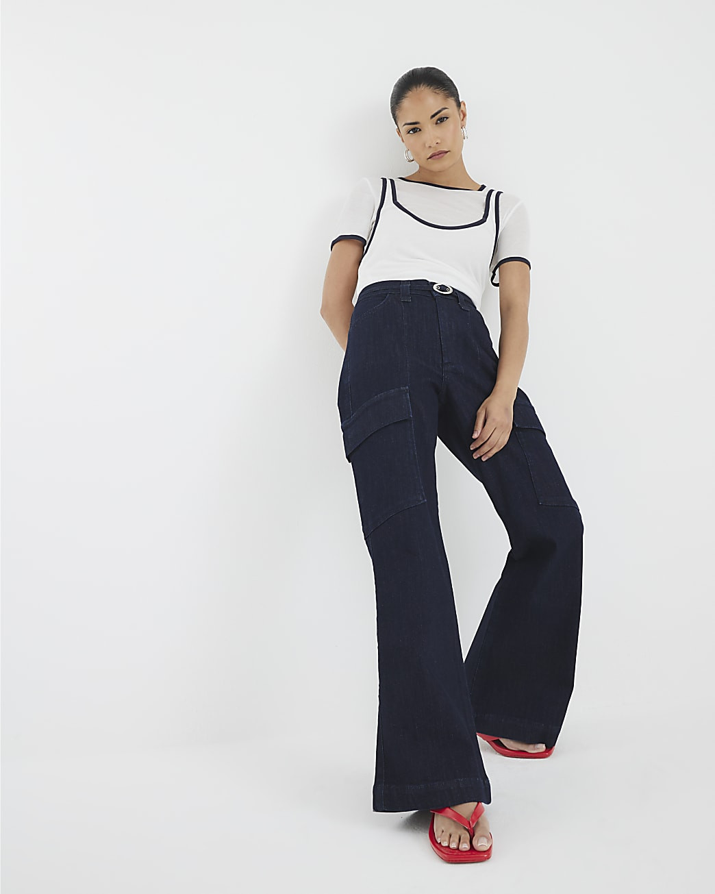 Petite Blue High Rise Relaxed Flare Jeans | River Island UK & IE