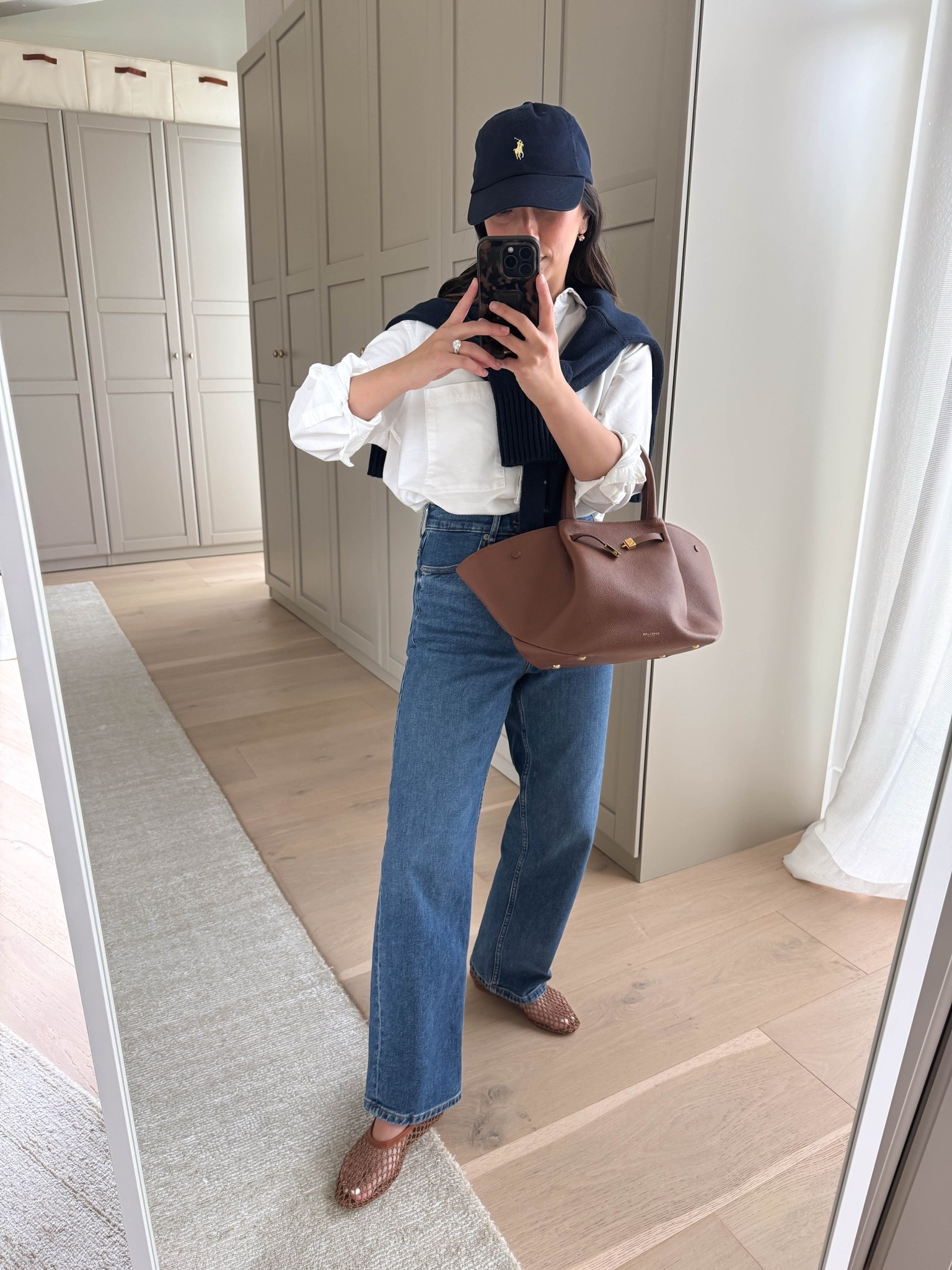 Another one of my outfit formulas I lean on - look elevated every time!

AYR Deep end shirt xs
Everlane Way High jeans 25
Everlane cotton sweater xs
Staud flats 35
Polo Ralph Lauren hat
Electric Picks earrings
Dorsey James 15”
DeMellier bag medium

Spring outfits 2026, petite style

#LTKootd #LTKmomlife #LTKPetite