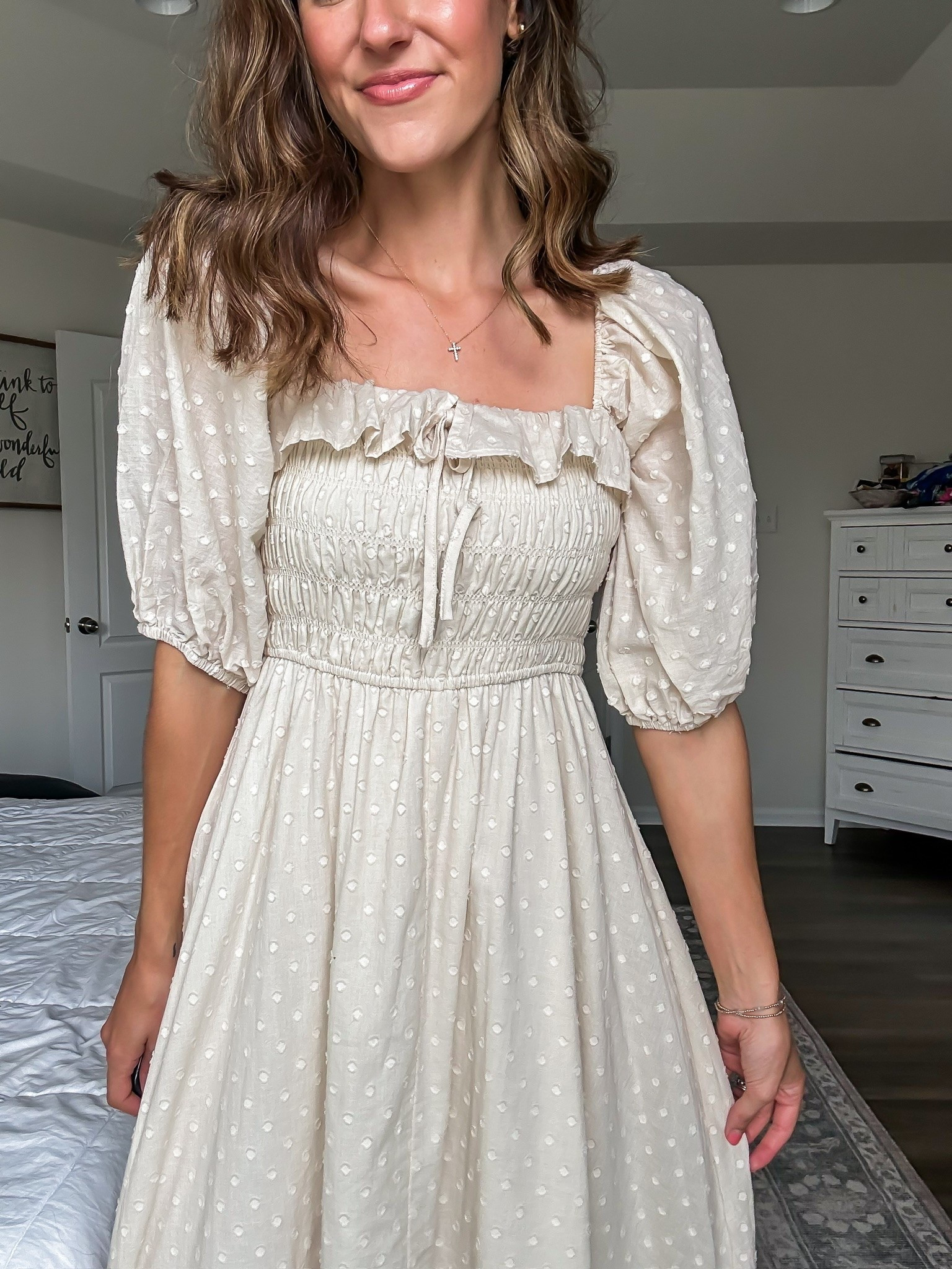 Cream polka dot dress from Amazon with smocking + puff sleeves

#LTKootd #LTKSeasonal