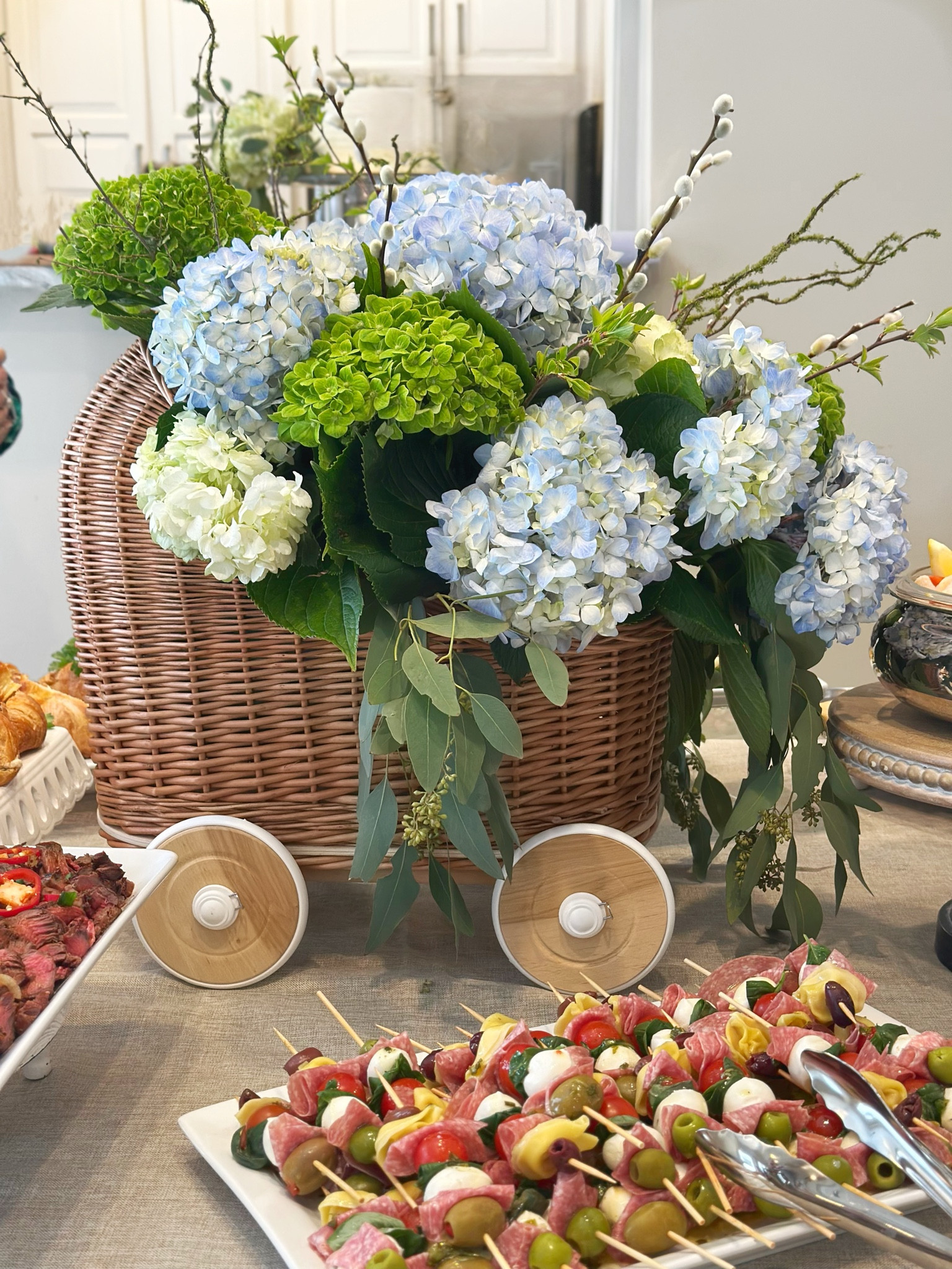 Julie recently hosted a beautiful baby shower for one of her friend’s daughters, and every detail was carefully crafted to create a memorable celebration. The highlight of the event was a stunning rattan pram centerpiece, overflowing with delicate blue and green hydrangeas and lush eucalyptus. It added a whimsical yet elegant touch to the decor, setting the tone for a serene and joyful atmosphere.

https://southernhospitalityco.com/2025/03/14/showstopping-baby-shower-centerpiece/

#LTKParties #LTKBump #LTKBaby