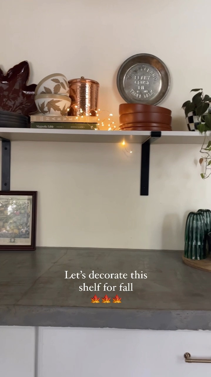 I love decorating this shelf for all the seasons! It was time to cozy it up for fall 🍂🍁

I like using functional items as decor. I like when my dishes, cups, bowls, and trays are pretty so they can double as decor!

I repeated a lot of colors with the rust/brown, black, green & rose gold!

The twinkle lights add a touch of fun! ✨

The pie pans are family heirlooms & I thought they were perfect for fall for the apple pies 🥧 









#LTKSeasonal #LTKStyleTip #LTKHome