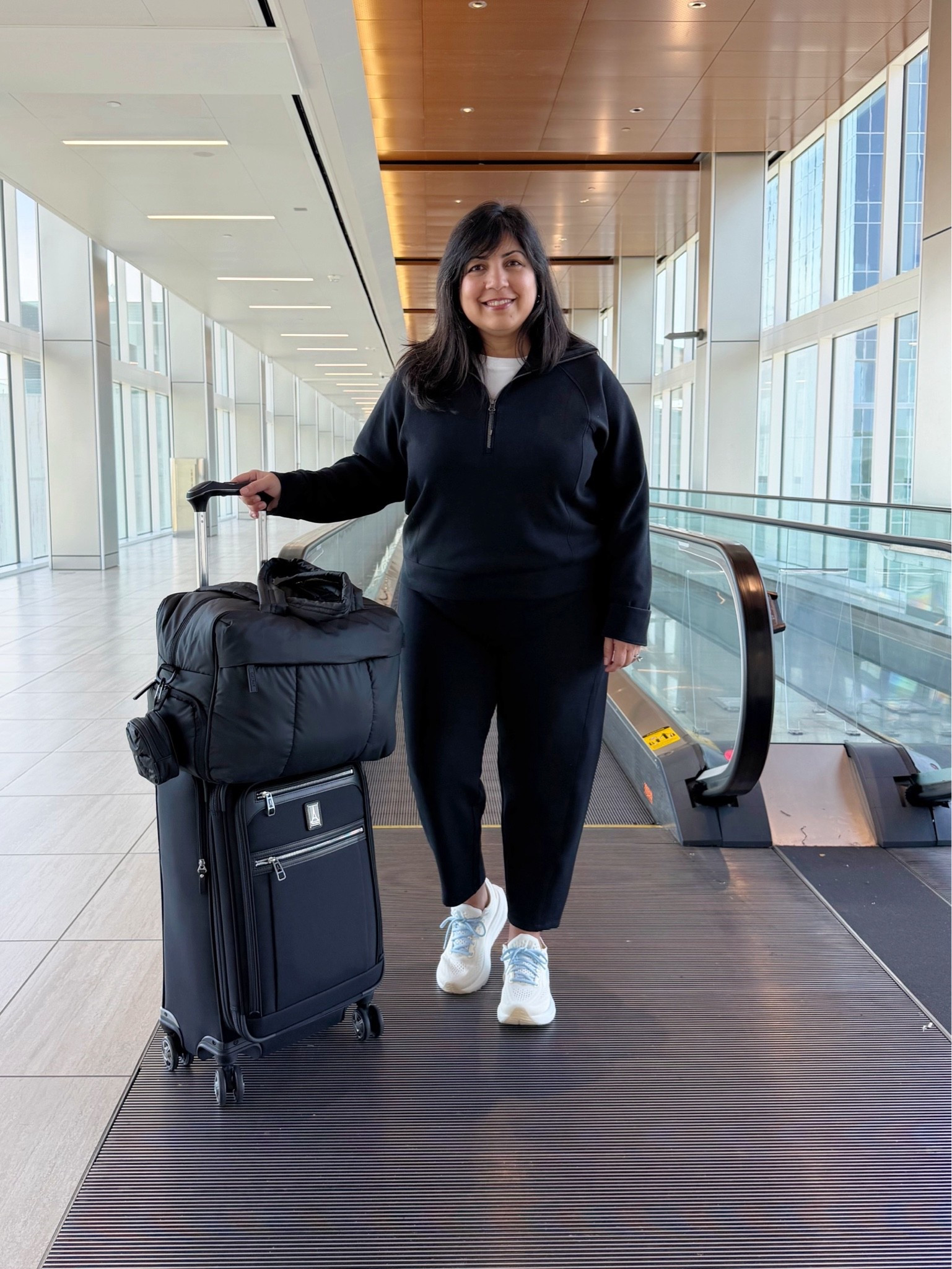 Spanx Air Essentials Sale! 25% off regular price AirEssentials pieces with code AE25. Such a great sale! Lots of other styles already on sale and deeply marked down. Love this Spanx Air Essentials set as a travel outfit. So soft, comfy and cozy and great for airport outfits and long flights! Wearing size large in the top and large petite in the pants. This barrel leg pant style is new for me and so far I’m loving the silhouette! Grab this classic top for 25% off and the pants for under $50! Brooks sneakers. CALPAK Luka duffel travel bag. Travelpro carry-on suitcase luggage.

#LTKSaleAlert #LTKTravel #LTKMidsize
