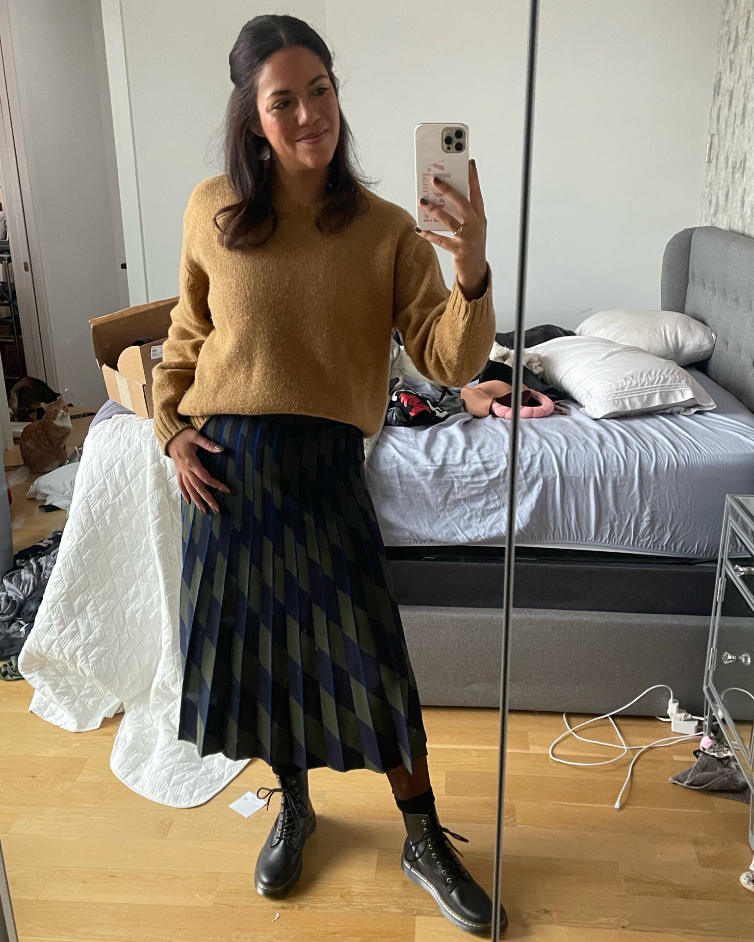 A cozy casual office outfit for a chilly winter day. Wearing size medium Tory Burch sweater and skirt and size 10 doc martens  

#LTKworkwear #LTKstyletip #LTKSeasonal