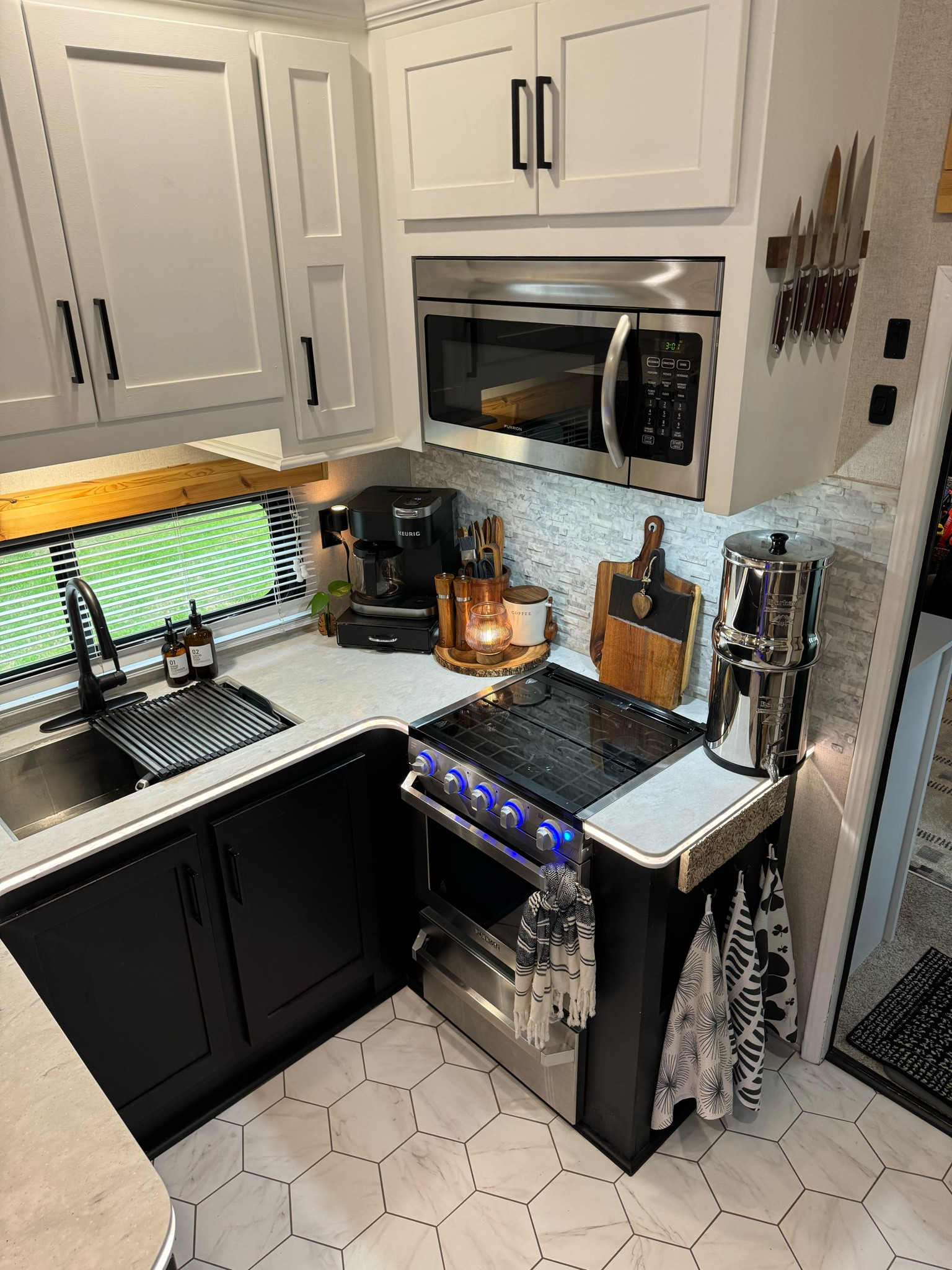 Tiny Spaces fully functional kitchen with all of my favourite things I love having all of the warm, moody accents and tones. It’s very clean and modern living in a RV. 

#LTKfamily #LTKSpringSale #LTKhome