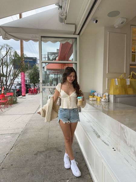 spring morning coffee run ✨

spring outfit, jean shorts, yellow top, crop top, white sneakers, high top converse, knit cardigan 