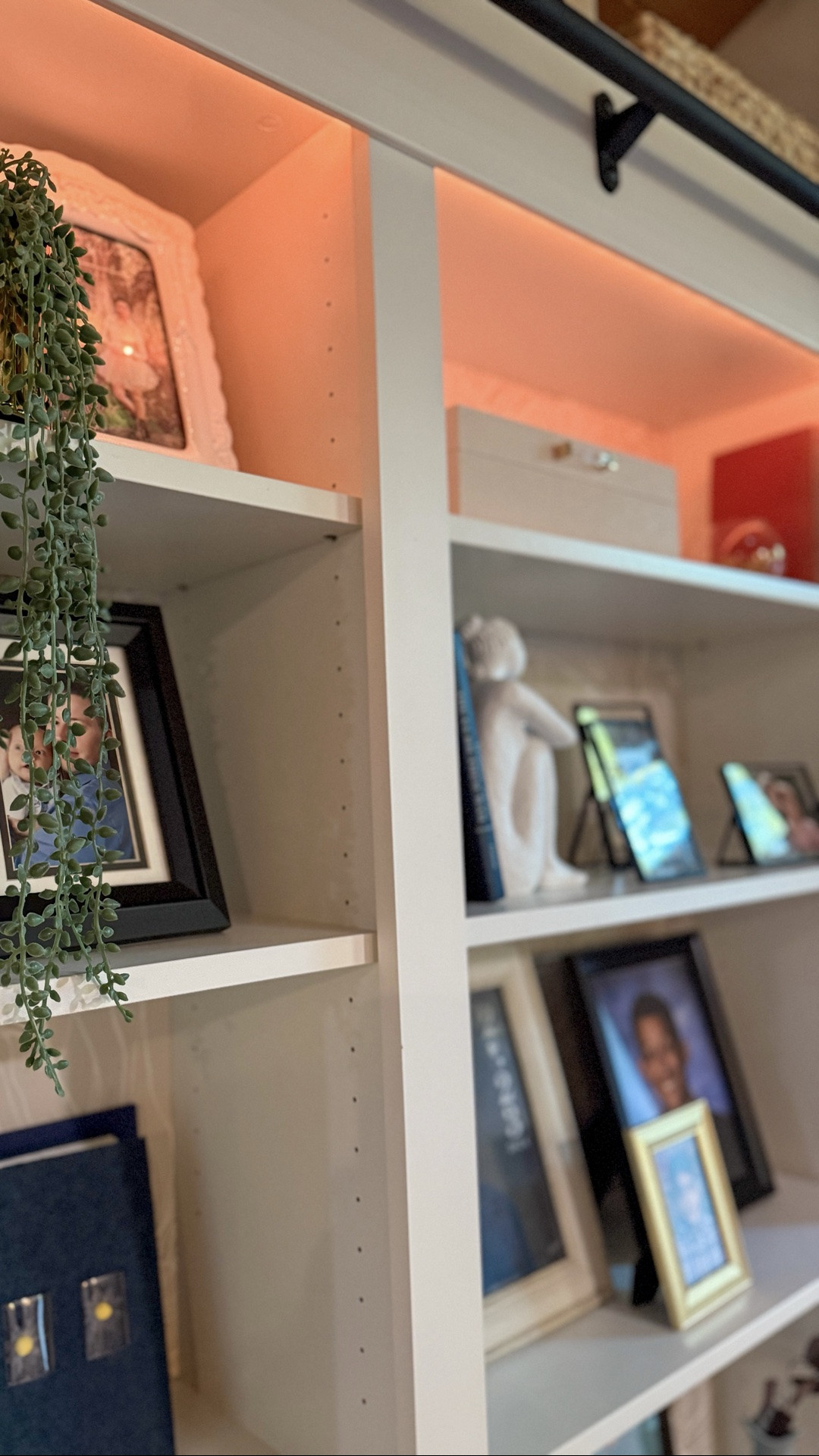 We transformed these IKEA Billy bookcases into a custom built-in complete with wallpaper backing, color-changing lighting, and a rolling ladder. Now it's the perfect place for books, family photos, and the keepsakes that make a house feel like home.

#LTKHome