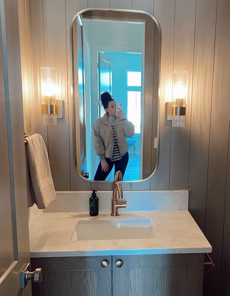 A gorgeous bathroom always calls for a selfie 📷 featuring a versitile puffer coat jacket, striped sweater and the best leggings ootd along with stunning brass mirror and sconces. 

#LTKhome #LTKstyletip