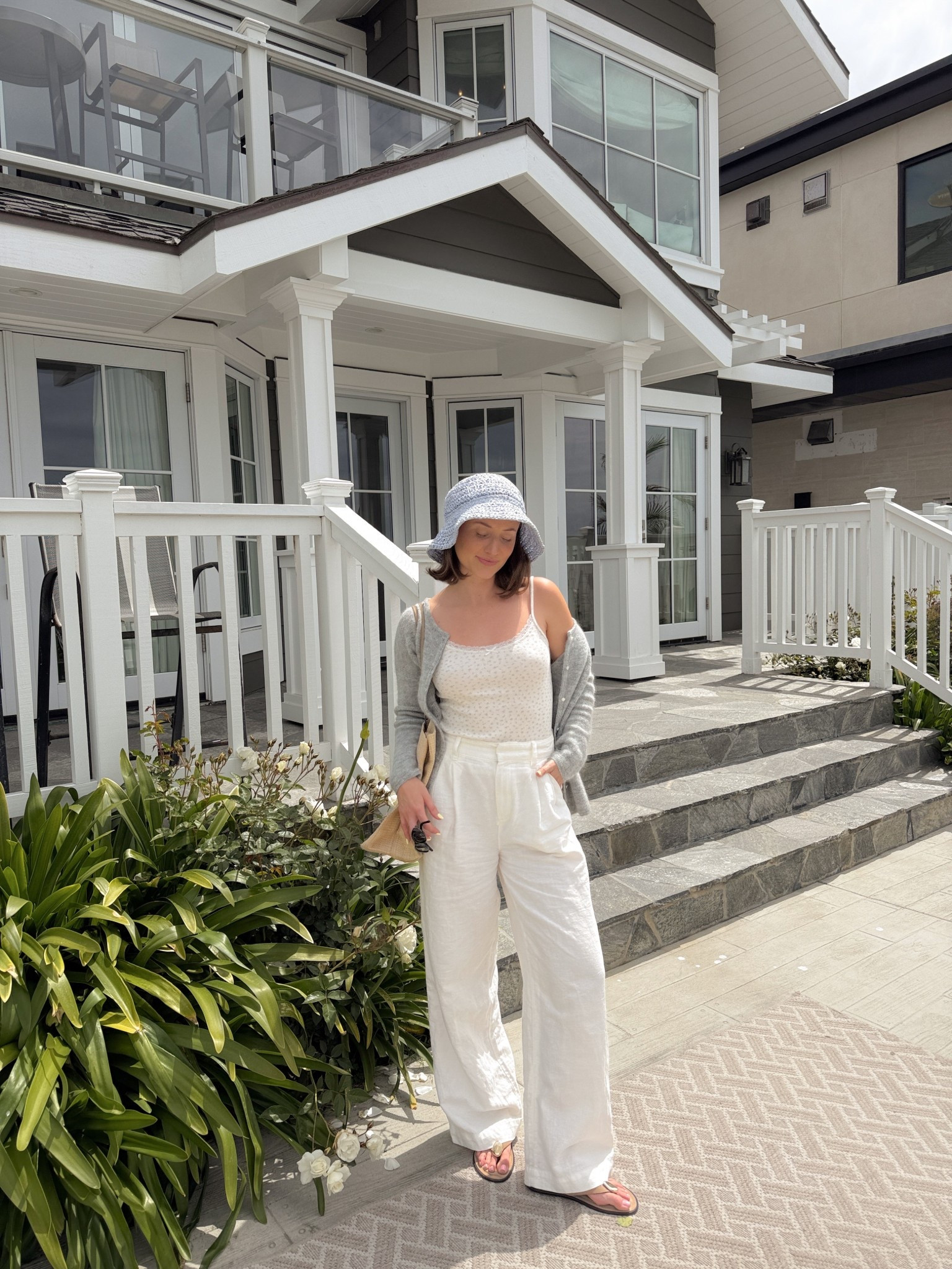 Coastal grandmother 
Linen pants, knit cardigan, and raffia hat

#LTKStyleTip #LTKSeasonal