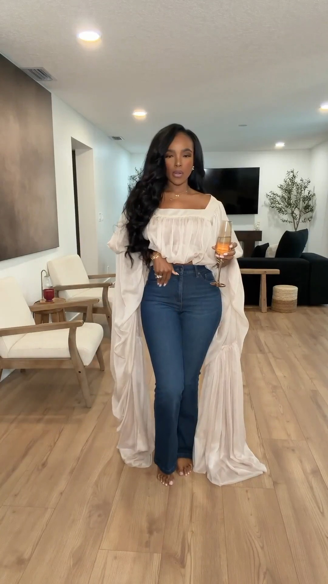 Hi Babes! 

This top is PURE drama in the best way 🤍 The oversized flowy sleeves mixed with classic denim gives that effortless rich-girl energy without trying too hard. I love how the silhouette feels soft and feminine while still looking elevated and modern.

This is one of those statement tops that instantly makes basic jeans feel like a full outfit. Perfect for date nights, dinner with the girls, wine nights, or vacation evenings when you still want to look put together but comfortable.

Perfect for:
• Date night outfits  
• Vacation dinner looks  
• Girls night outfits  
• Elevated denim styling  
• Summer to fall transitions  
• Birthday dinner outfits  

Everything is linked below ✨

xx Kira | IG: KirasFashionFinds

34D - 27 - 40 • Size Small or 4
