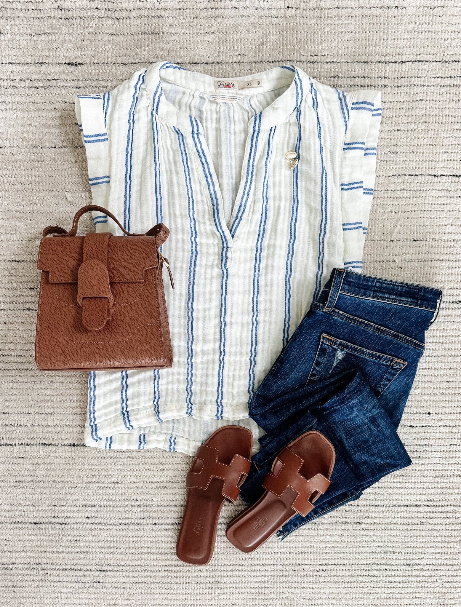 Summer outfit with cotton gauze top paired with dark wash skinny jeans and sandals. Love this top because it’s breathable and doesn’t get too hot! Can be dressed with shorts or skirt, too

#LTKStyleTip #LTKSeasonal